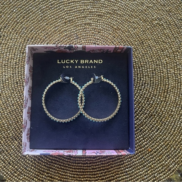 Lucky Brand Jewelry - Lucky Brand Hoop Earrings golden color with embedded turquoise color stones.